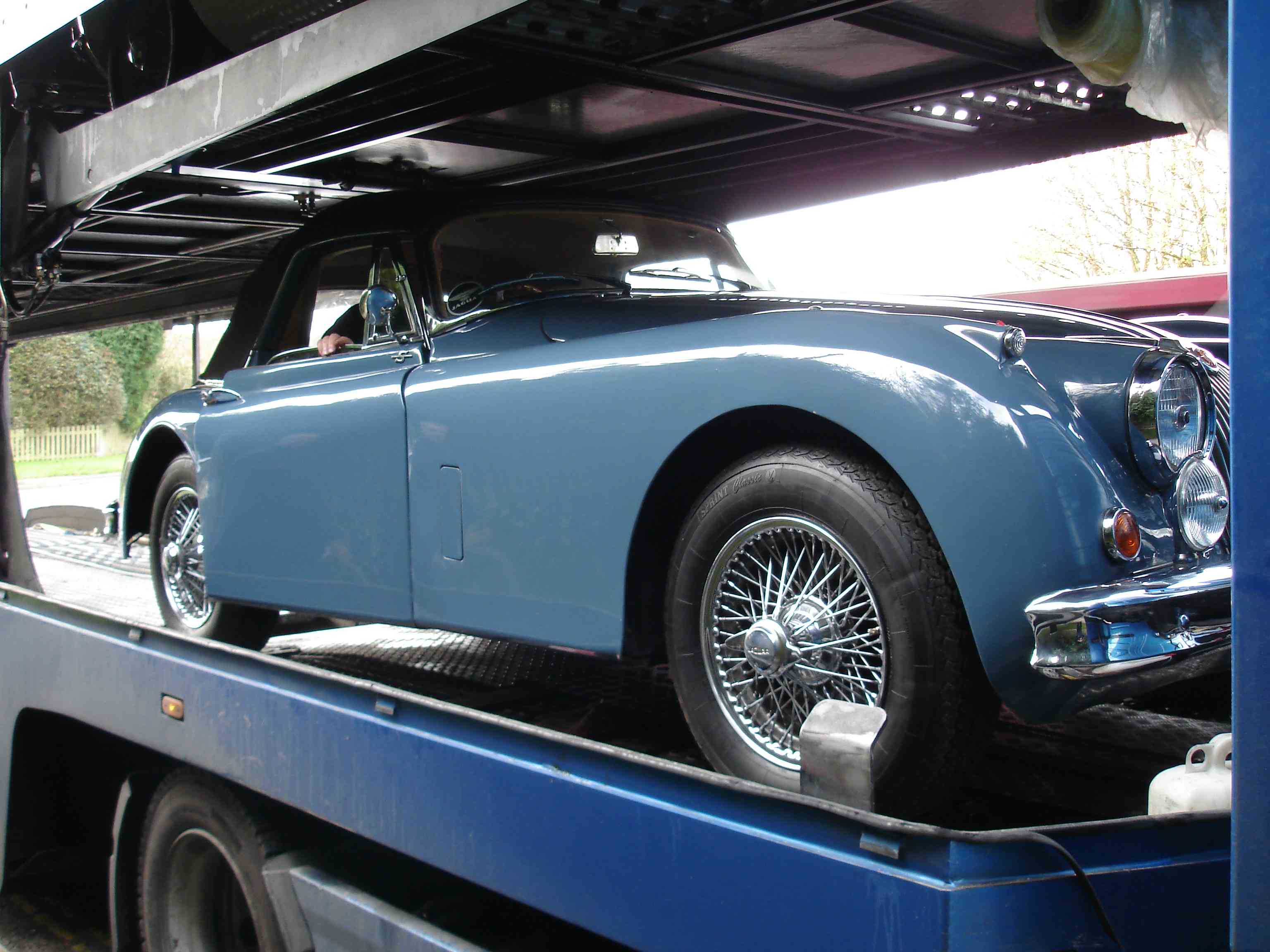 Jaguar XK150 DHC loaded onto lorry