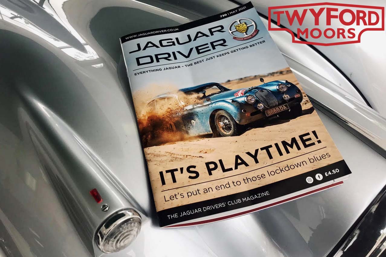 Jaguar XK150 rally car in magazine